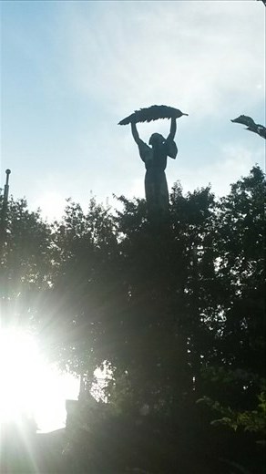 The kickass statue at the top of the Citadella. A woman holding a leaf. 