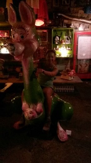 Karmen on a dinosaur at the hookah bar