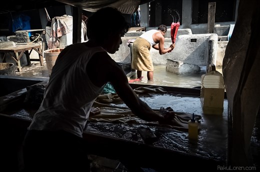 Clothes are soaped and scrubbed before having the dirt literally smacked out.