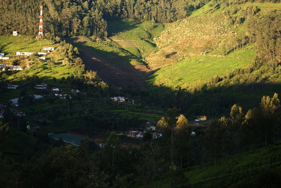 Bright Sun rise over Conoor valley below