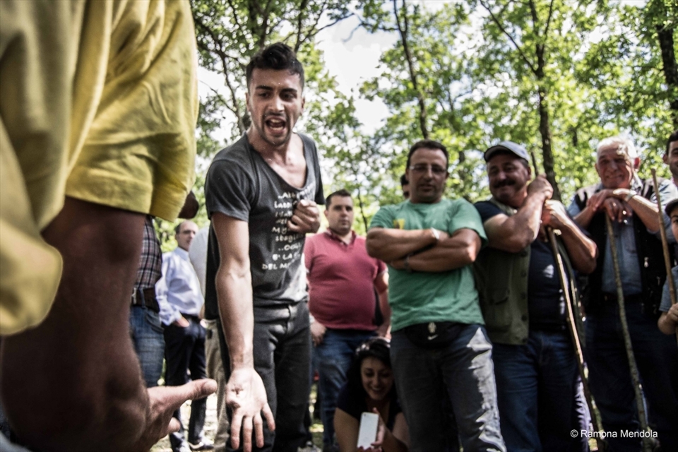 Men are playing ‘Morra’, an old popular game of  South Italy