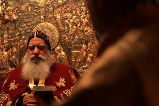 Faces of the Middle East - A Christmas Prayer.

Bishop of Christian Orthodox Church gathers with his congregation in an intimate prayer within the Church of the Nativity, Bethlehem. The church is considered one of the oldest and is adorned in gold and precious stone. Thousands of Christians gather within a tiny space for their chance to pray at what is considered to  mark the birthplace of Jesus Christ.