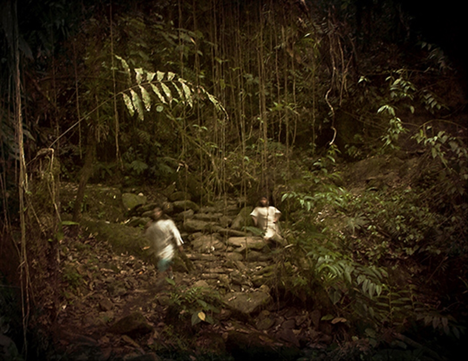 Same two Wiwa boys but walking fast.