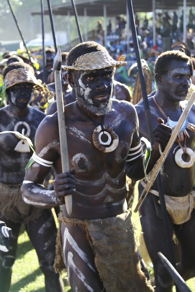 A Warriors Gaze:

A Solomon Island Warrior leads his tribe onto the Honiara sports field as part of the welcoming ceremony. It was a spectacular show of colour and culture as delegates from all the pacific nations came dressed in traditional garments and performed traditional dances, songs and chants for the 30,000 strong crowd.