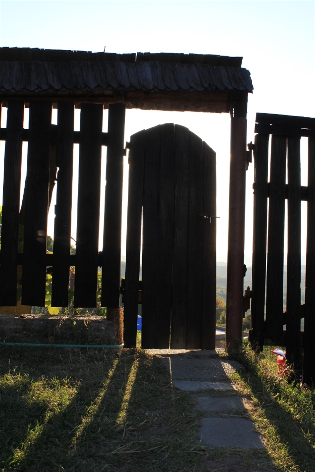 This photo was taken in Cluj at a Monastery and it represents a wooden door illuminated by the fading sun.
