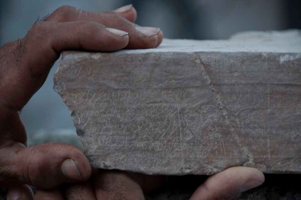 Two generations – one born well before the oil wealth transformed the country and one born into it – reverently hold an inscribed stone from the old mosque while telling the story of a famous Imam who prayed in the original mosque over 450 years ago while en route to recruit fighters against Portuguese rule over coastal Oman.