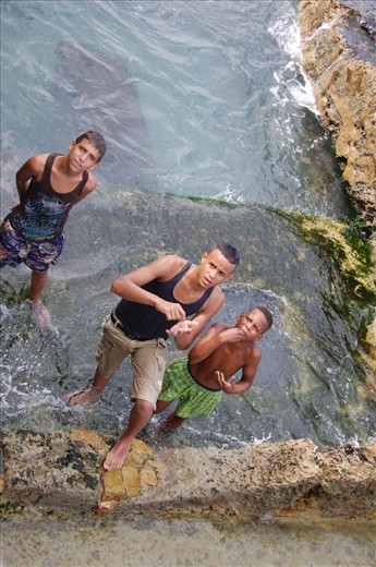 Cash in hand - nothing is free theses days. A group of Cuban boys were playing chicken with the waves on El Malecon Habanero in the old part of Havana. When I produced a camera, they demanded money!
