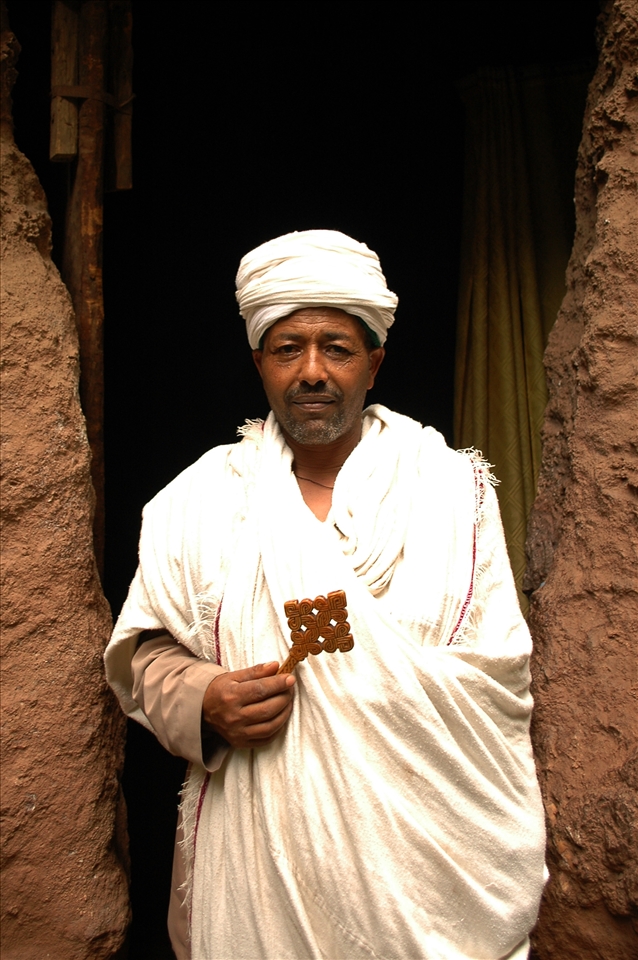 A priest outside a rock-hewn church at Lalibela