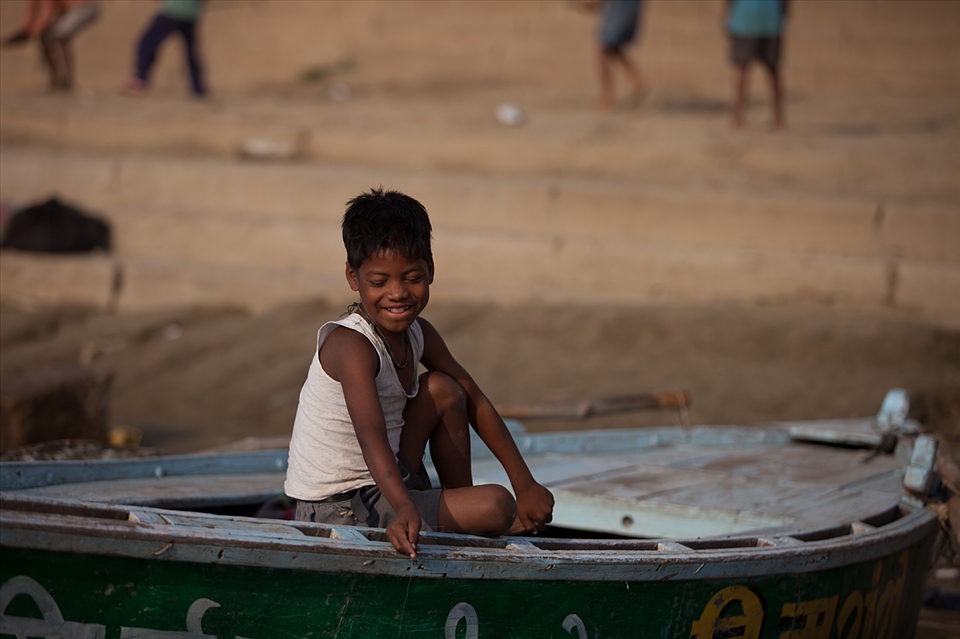Young boys are brought up to work for money on boats, ferrying tourists about.