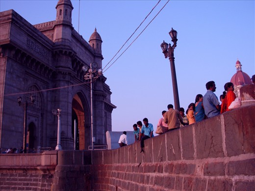 Locals at the Gateway of India right after the sunrise