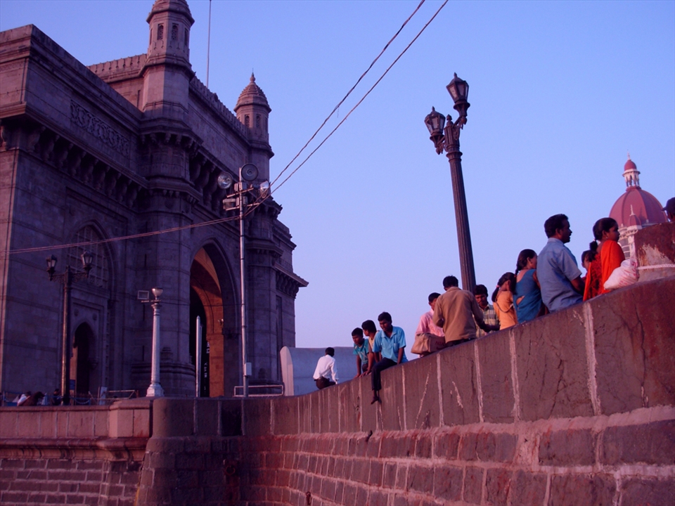 Locals at the Gateway of India right after the sunrise