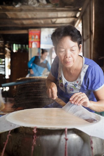 In the process of making one of Vietnamese favourite snack. Thin rice biscuits.