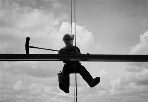TanSonNhat Airport is Vietnam's largest airport. He was the only window cleaner