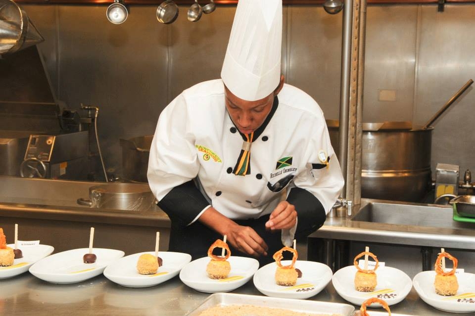 Process of completing Plate Presentation of Ackee and Scotch Bonett cheesecake 