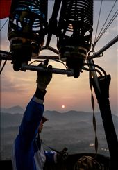 6am was our pick up for the morning flight. When we arrived to the take off location, we were greeted by a flurry of workers, laying out and preparing the hot air balloon for flight. It was a strange sight to see the vessel that was going to take you 1km into the air being inflated. Once we were up, the sun began to rise. The morning fog that filled the limestone valleys glimmered like pale water. All the while, the pilot was in contact with the ground team, informing them of wind strength, and the possibility of a landing location. We saw the town begin to wake up. Monks in orange garb created streaks of colour that were highlighted against the dull grey of the pavement. The image of the second balloon floating amongst the mountains surrounded by mist bathing in the morning light is one I will never forget.: by rhysacker, Views[359]