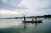 In Vietnam, fishing techniques are ancient. While some lower nets on the shores, most of the fishermen go out in their boats and throw the nets themselves. Here a fishermen and his family try to catch some fish to sell at the market.: by ricardoperna, Views[1030]