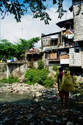 Target areas to build squats are usually slums like riversides and along the railways in Metro Manila. Creeks around the metro are being used as dump site resulting to heavy floodings in the urban areas during rainy season.: by ricobagsit, Views[709]