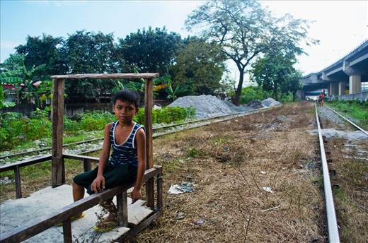 This is Boboy. He became vagrant when his mother got hit by a speeding train while maintaining her vegetable garden about a year ago. These illegal inhabitants utilize vacant lots off the railroad to grow vegetables to sell their crops to local markets.