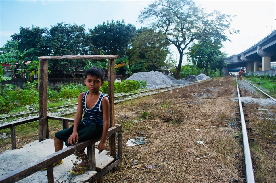 This is Boboy. He became vagrant when his mother got hit by a speeding train while maintaining her vegetable garden about a year ago. These illegal inhabitants utilize vacant lots off the railroad to grow vegetables to sell their crops to local markets.