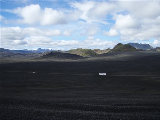 The road in the black desert. If not cars it would be hardly noticeable.