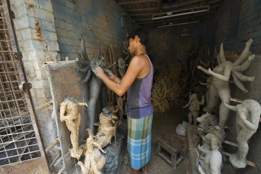 Idol maker created idol with bamboo,straw and coverd by soil.