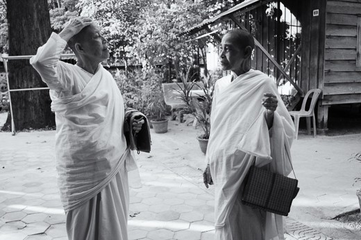Dressed in their prayer robes, two Buddhist nuns had a brief conversation before entering a temple inside the monastery. 

This was the time when I was already starting to establish relationships with the nuns. The nuns already knew of my presence in their community and even with the language barrier they have been nothing but kind and gentle about my presence. I had been striking conversations with them thanks to my tuktuk driver who acted as my translator.

When I saw this photo while file organizing, it eventually became my 