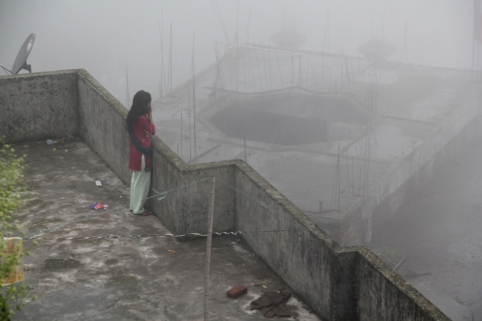 Concrete mesh piercing through Himalayan clouds. A distress call?