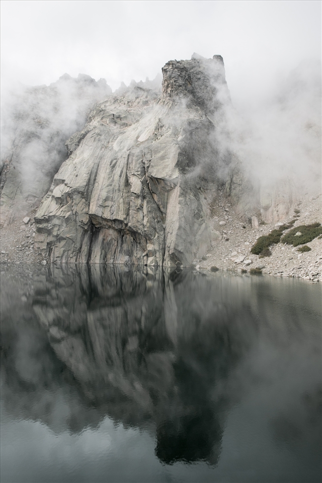 after a foggy day suddenly this rock appeared from the lake