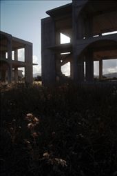 The area surrounding the town of Gennadi, the southern-most town on Rhodes, is littered with silent shells of unfinished buildings, reclaimed mostly by tough, prickly weeds. The area had suffered a notable decrease of investment in recent years, leaving these monoliths towering over the fields that probably would have been home to the once growing community of British expatriate retirees.: by robindhevans, Views[723]