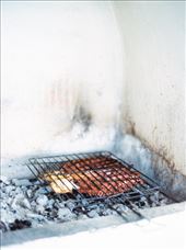 A meal of grilled calamari is being prepared in Santorini, Greece: by robink, Views[376]