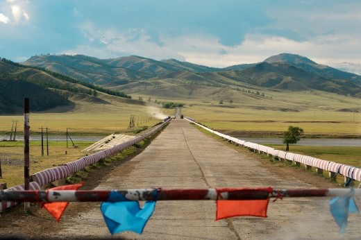 This picture was taken somewhere on the road between the capital Ulaan Bataar and Lake Khovsgol in the north. I attempted to capture the different landscapes and space that continually changes when you travel there. 