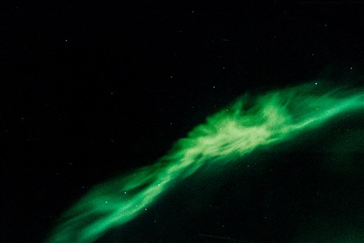 Witnessing the aurora borealis over Yellowknife, NWT while traveling to the ship