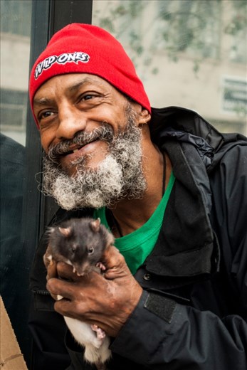 Fransisco holding Even Steven while remembering finding him as a baby in skid row.
