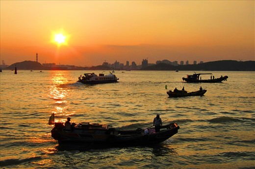 Xiamen is considered a costal city. This photo shows the beauty of Xiamen's clean and beautiful costal area during sunset and the traditional lifestyle of the people amidst progress.