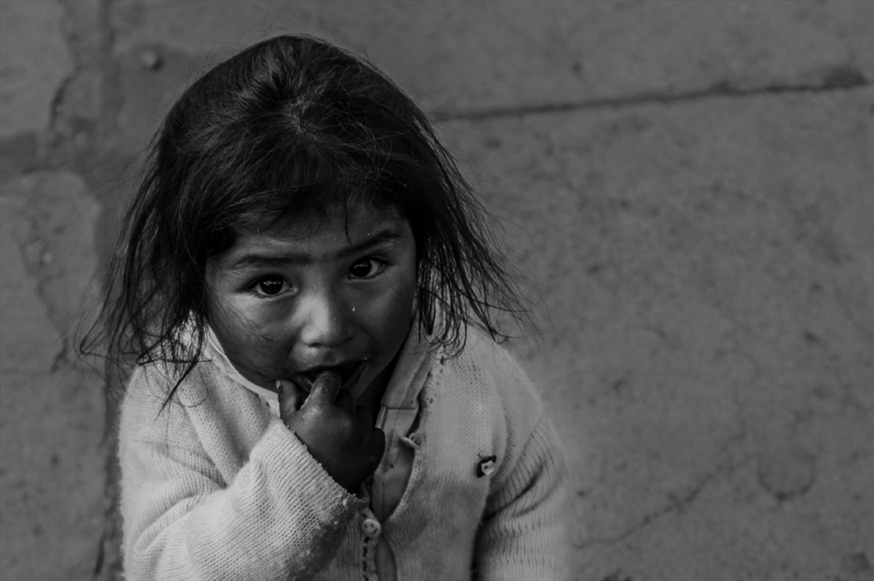 I don't know this girl's name, neither her age. But she was just there, a couple meters from her mother, waiting for a van to get back home, eating some snack like there was nothing else in the world. Until she sees me, with the camera, come walking and just stand, staring, not to camera anymore, but to foreign guy. Even I was unable to have a conversation with her, I doubt that anyone can say more than that two big black and innocent eyes.