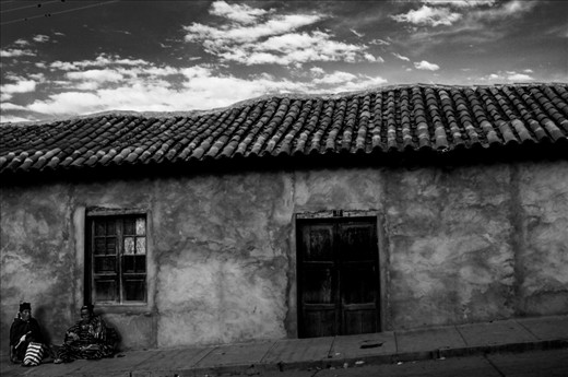 A couple waiting to go back home after the Sunday street market. 