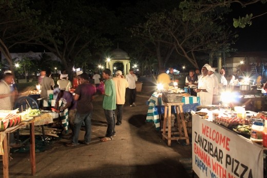 Forodhani Night Market comes to life in Stone Town, Zanzibar. A quiet energy and bustle characterises the area. Local Zanzibaris set up stalls and grills and offer some of the most delicious seafood and other local delicacies you can find.