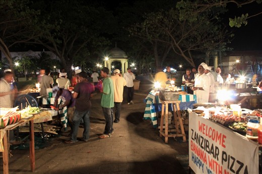 Forodhani Night Market comes to life in Stone Town, Zanzibar. A quiet energy and bustle characterises the area. Local Zanzibaris set up stalls and grills and offer some of the most delicious seafood and other local delicacies you can find.