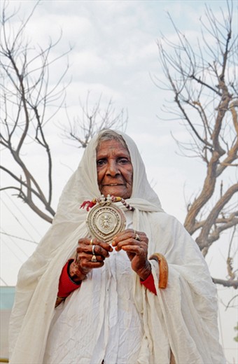 Old lady begging in the streets of Pushkar in Rajasthan,India.