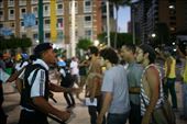 As the original protesters scatter, students voice their frustrations to the  baton-wielding police attempting to calm the crowd.  In the background, a loiterer prepares for the worse and sports a gas mask.  This protest was the final one of many throughout the day.: by roka, Views[453]