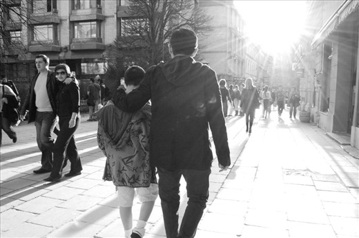 A father and son enjoying the city life of Sarajevo as if they had all the time in the world.