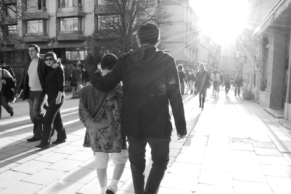 A father and son enjoying the city life of Sarajevo as if they had all the time in the world.