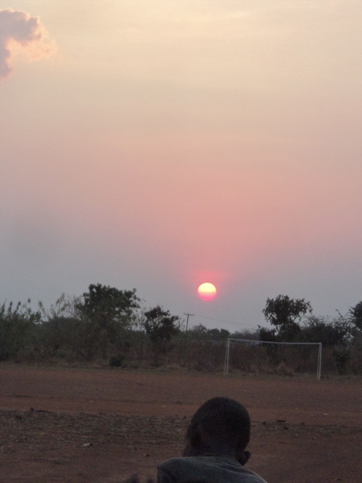 The kid on sky of hope

Everyday Alinafe sit and leave the sun go away  through the sky with the hope of a better day.
