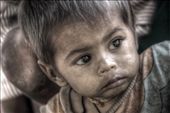 It is a picture of a little boy who does not even know what the outside world is all about. Yet he is facing all the hardships right from his childhood. His face full of innocence attracted me.: by ronit, Views[219]