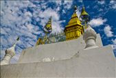 «Phu Si, Luang Prabang, Laos» 
Luang Prabang, Laos, December 2012. 
Phu Si is a 100m high hill in the centre of Luang Prabang. After climbing 328 stairs, we reach the summit of the hill, where we find Wat Chom Si, a Buddhist temple, which is one of the main attactions of this old town. The gilded stupa of Wat Chom Si seems to be looking at the sky.: by rosafurtado, Views[1251]