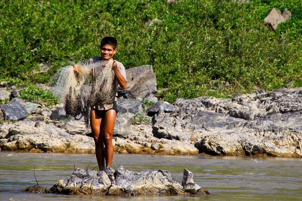 «A fisherman on the Mekong river, Laos»
Mekong river, Laos, December 2012. A fisherman is working while we were sailing the Mekong up on a slow boat, from Luang Prabang to the border with Thailand. Many Lao people, like this fisherman, depend on the Mekong to live.