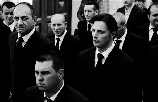 The men take turns to carry the heavy statue of the Virgin Mary Desolate.