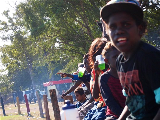 The young boys cheering on their brothers during the footie match. Education is present, but the youth still struggles to preserve their culture, as many of them speak only english and a creole version of the dialect used in all of the Arnhem region. 