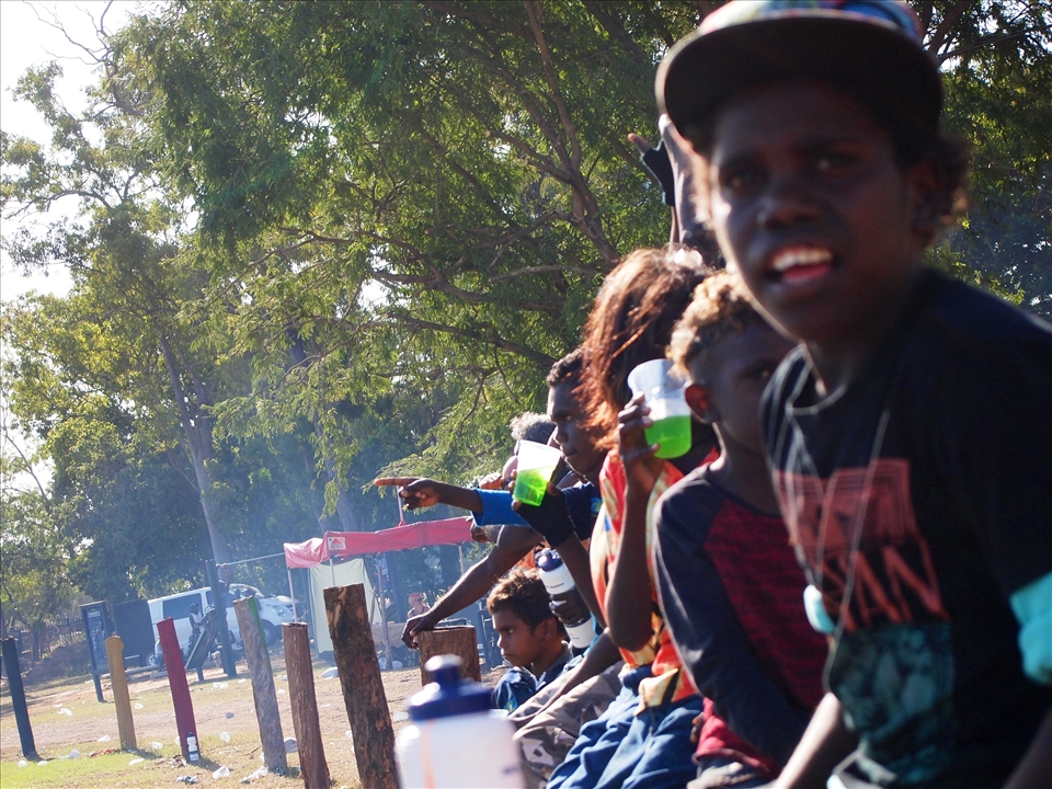 The young boys cheering on their brothers during the footie match. Education is present, but the youth still struggles to preserve their culture, as many of them speak only english and a creole version of the dialect used in all of the Arnhem region. 