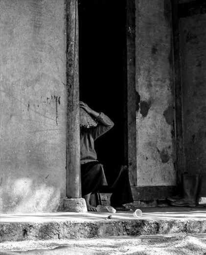 Men resting during lunch break, North Vietnam